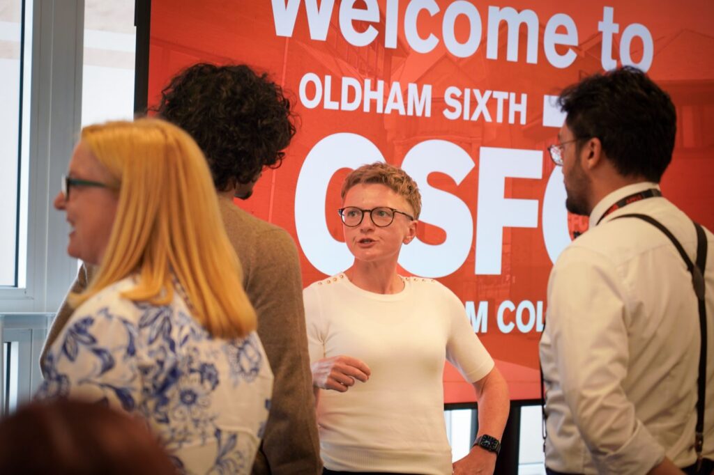 Bev Craig talks to students about the expansion of Our Pass